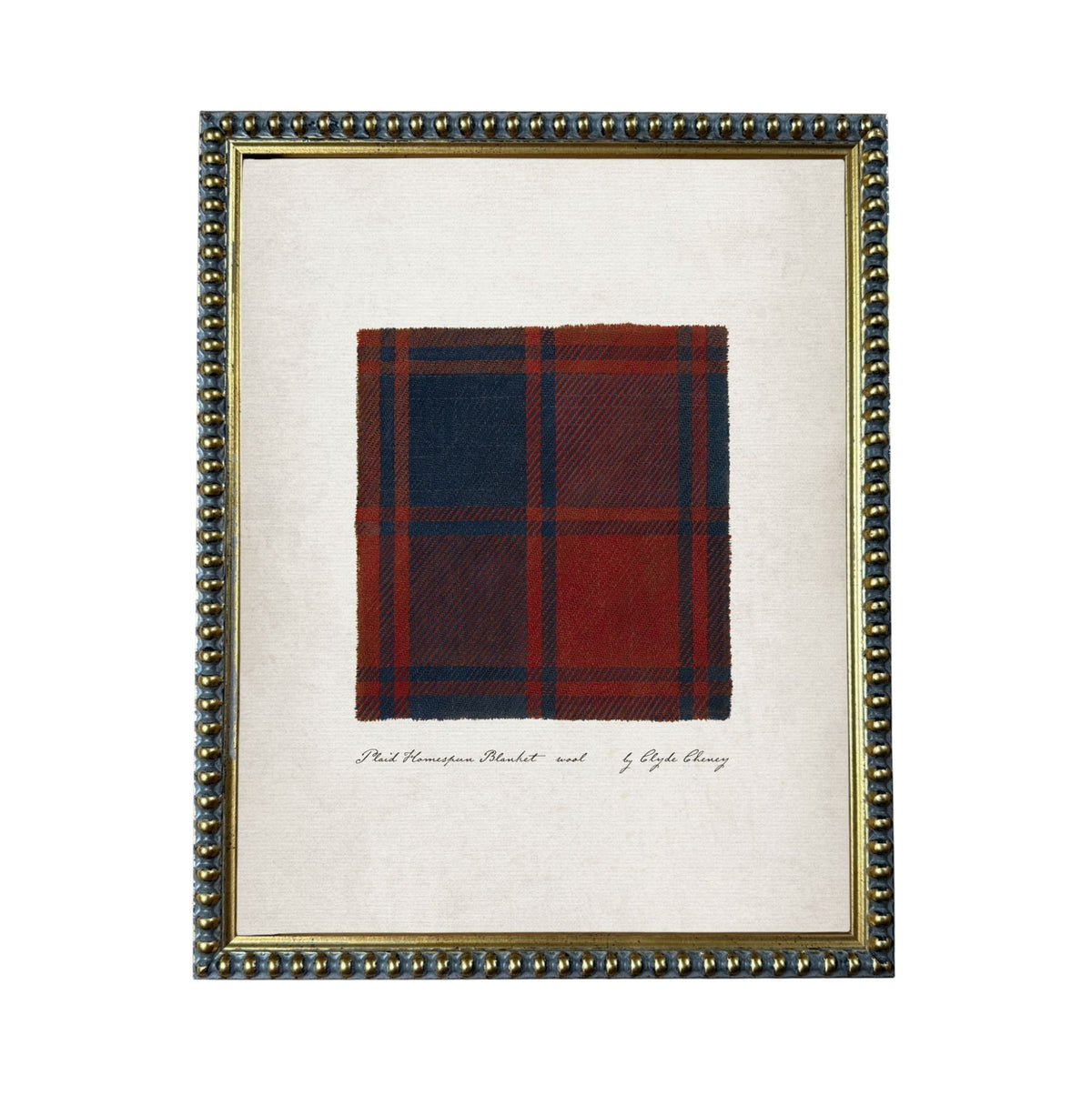 a framed piece of artwork with a close-up of a red and blue plaid fabric.