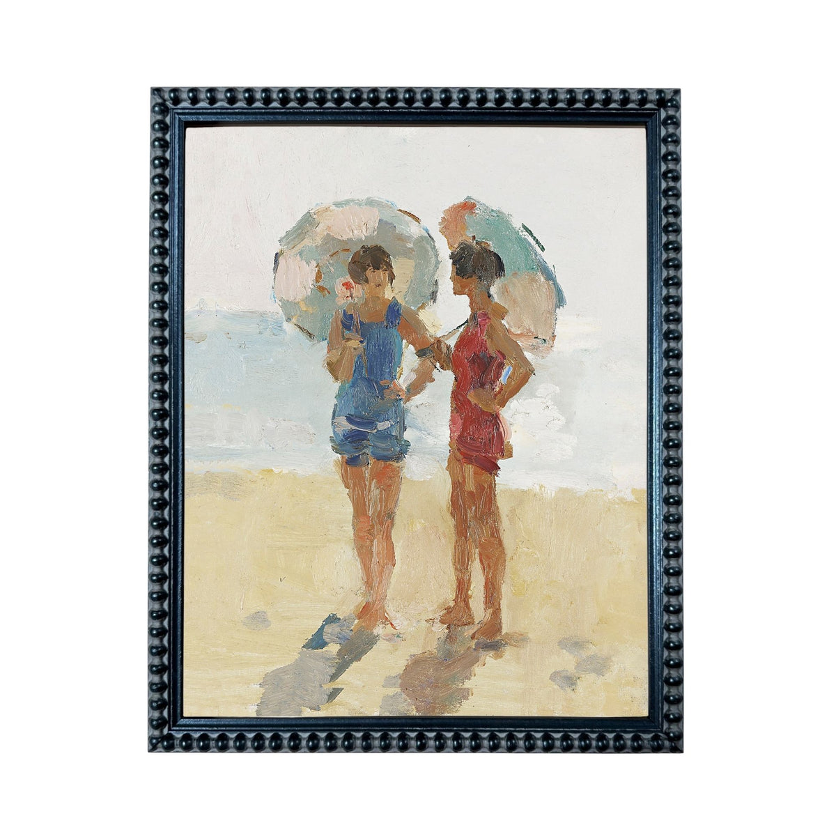 Two women standing on a beach, each holding an umbrella, with the ocean in the background.