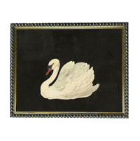 A framed painting of a white swan against a black background.