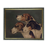 A framed painting depicting three beagle dogs in profile, with a dark background.