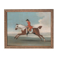 A man in a red coat is riding a white horse across a field, with a cloudy sky in the background.