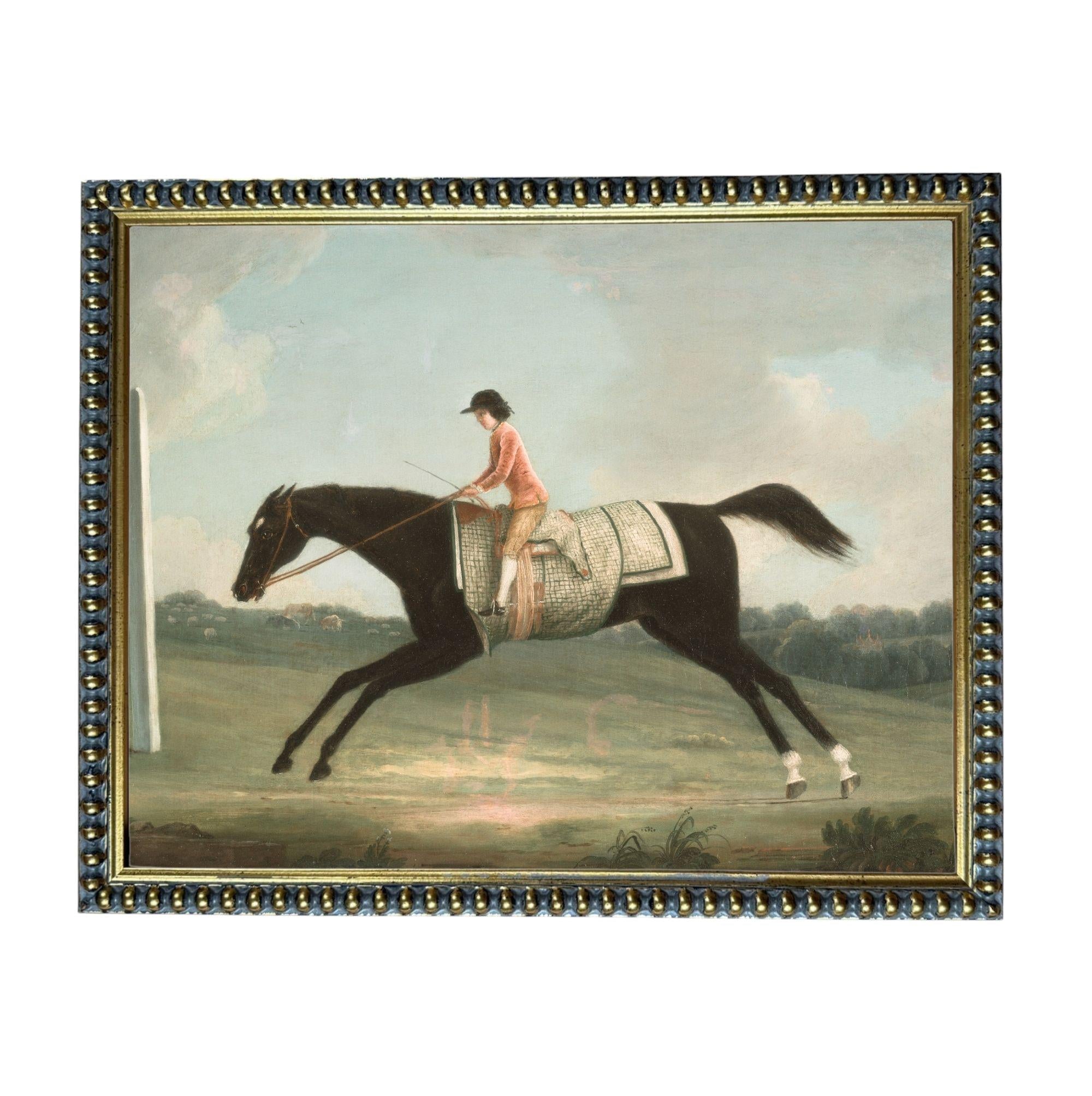A woman in a red coat rides a black horse across a grassy field.