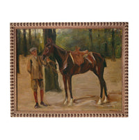A man in a hat and brown jacket stands next to a brown horse in a forest setting.