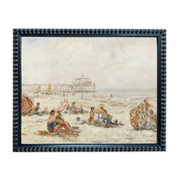 The image is a framed painting depicting a lively beach scene with people relaxing and enjoying the sun.