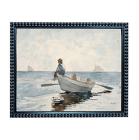 A man is rowing a small boat with two other people in the water, with sailboats visible in the background.