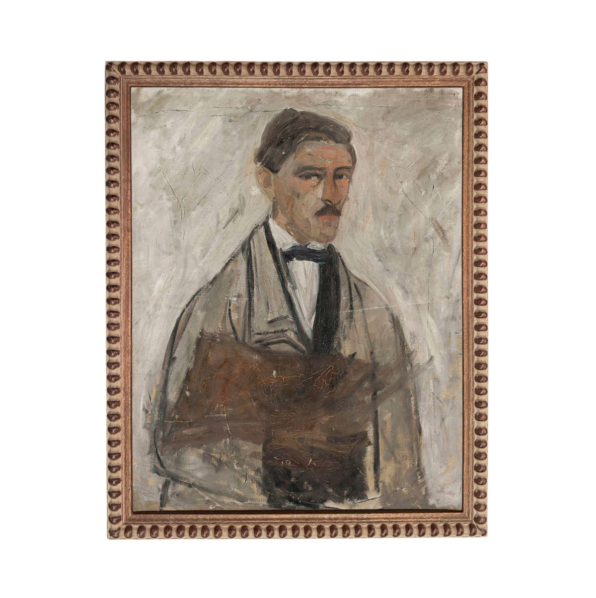 The image is a portrait of a man wearing a suit and tie, with a serious expression on his face.