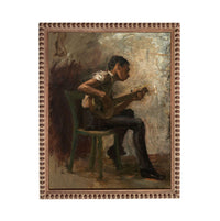 a man sitting in a chair and playing a musical instrument, such as a guitar or banjo.
