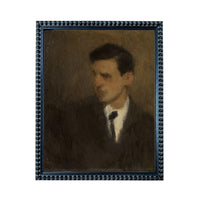 The image is a portrait of a man wearing a suit and tie, with a dark background.
