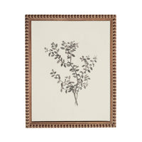 a framed artwork depicting a branch with leaves and flowers.