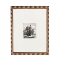 a framed print of a landscape with a pine tree in the center.