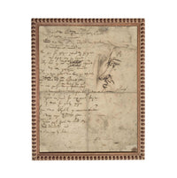 The image is a framed piece of artwork featuring a handwritten note and a sketch of a face.
