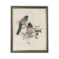 A framed painting depicting two colorful birds perched on a branch with leaves.