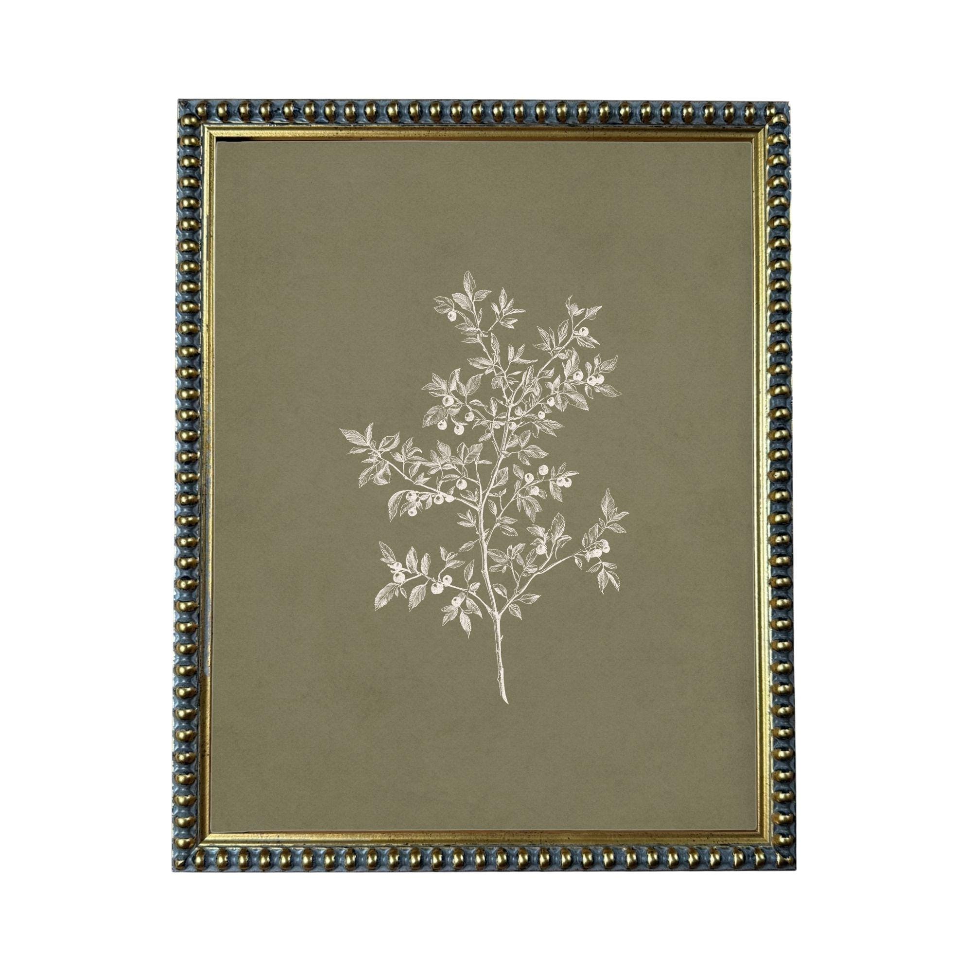 a framed print of a tree with white leaves against a dark green background.