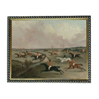 a group of people riding horses in a field, with some horses galloping and others running.