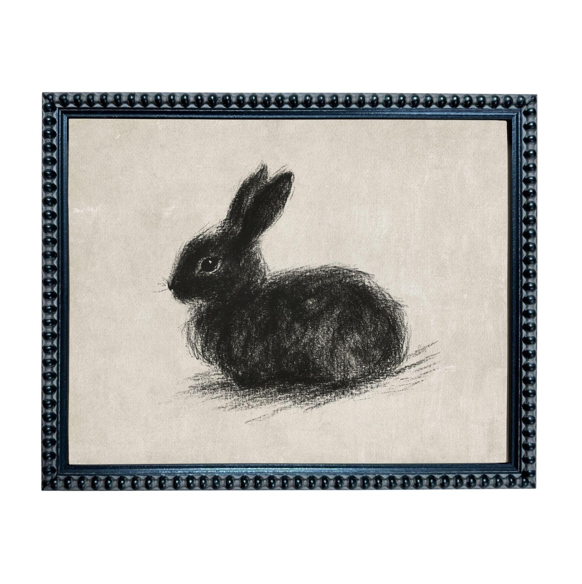 A black and white sketch of a rabbit sitting on a beige background, framed in a black frame with a decorative border.