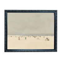 a crowded beach scene with numerous people enjoying the sunny day.