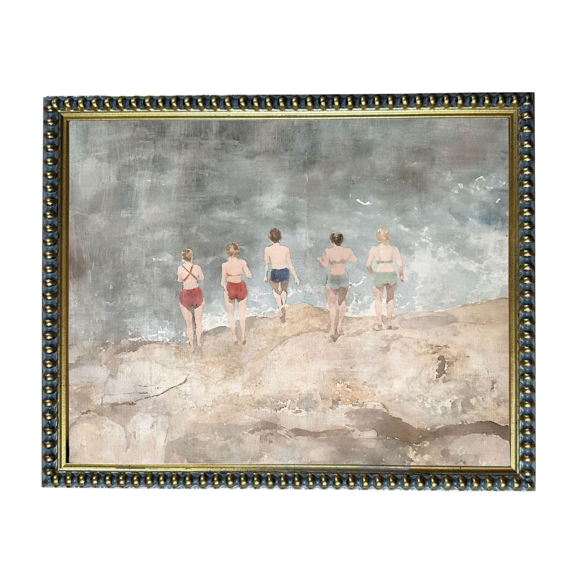a group of people standing on a rocky shore, with a cloudy sky in the background.