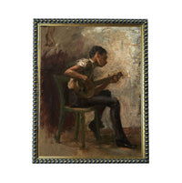 a man sitting in a chair and playing a musical instrument, such as a guitar or banjo.