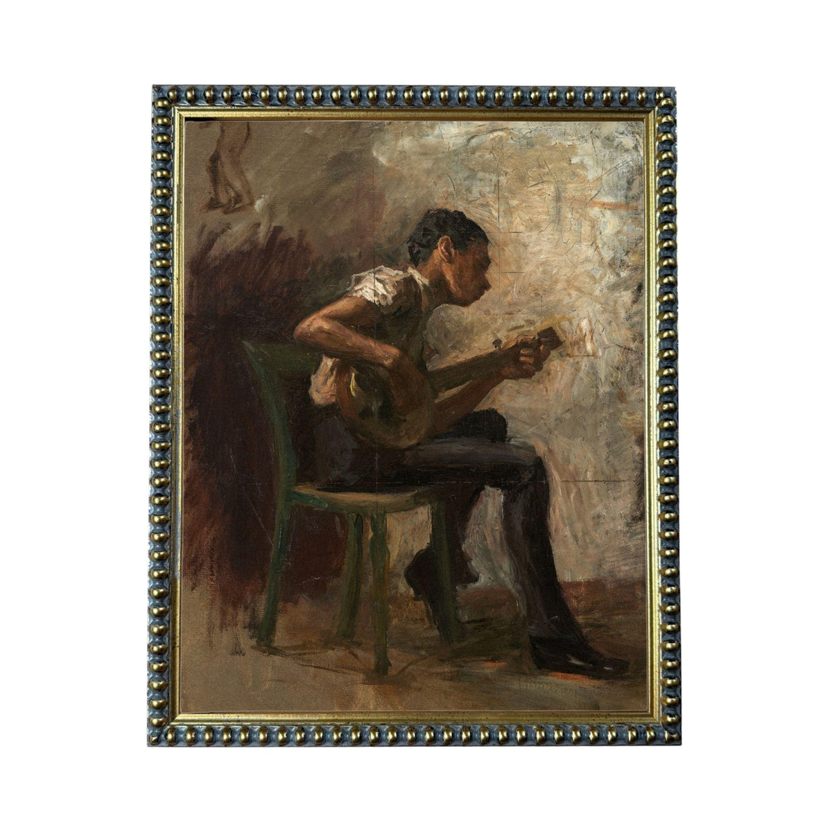 a man sitting in a chair and playing a musical instrument, such as a guitar or banjo.