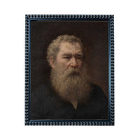 The image is a portrait of an older man with a long beard, wearing a dark jacket.