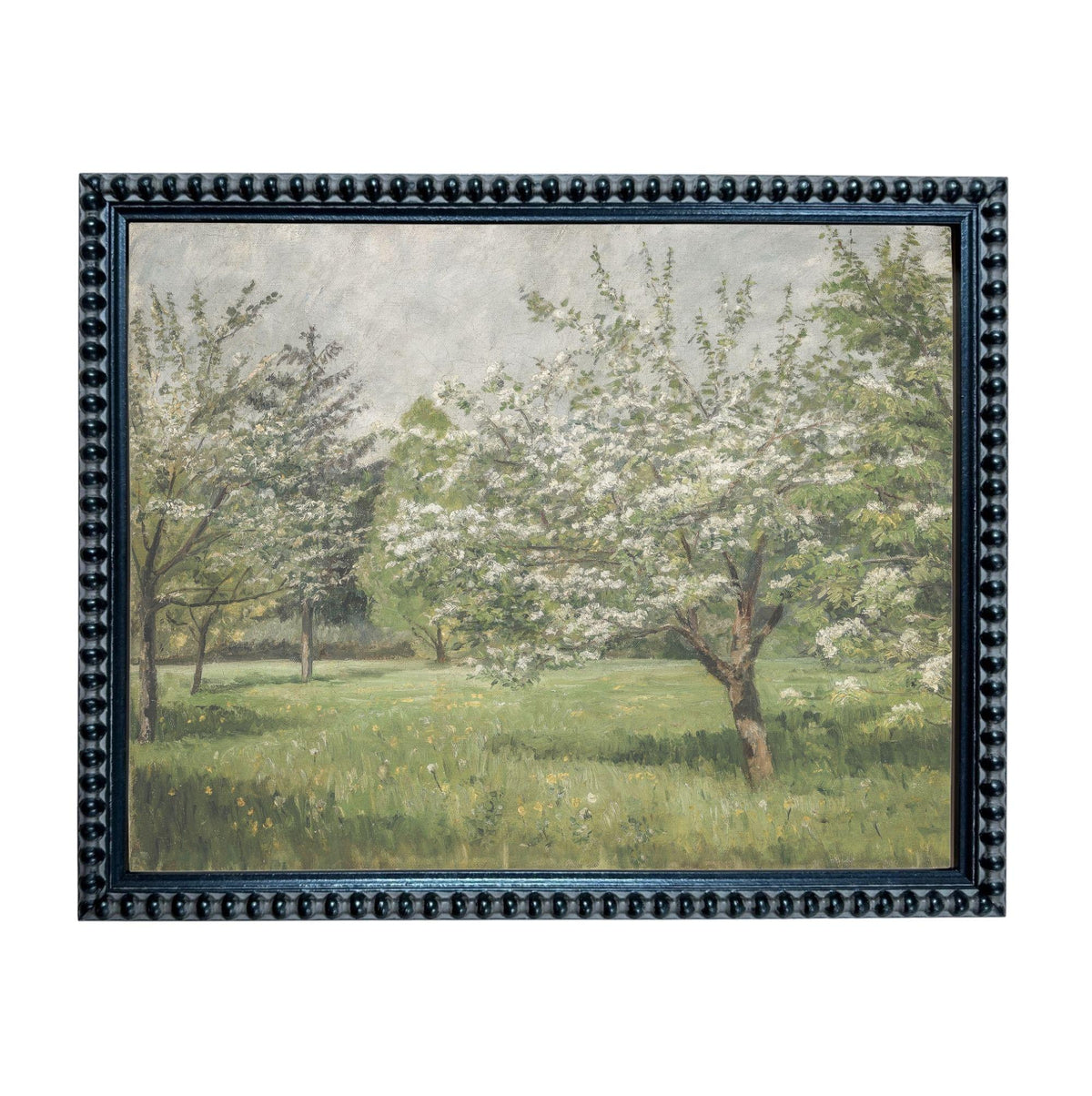 A framed painting depicting a serene landscape with a field of flowers, trees, and a grassy area.
