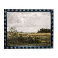 The image is a framed painting depicting a serene landscape with a field, trees, and a cloudy sky.